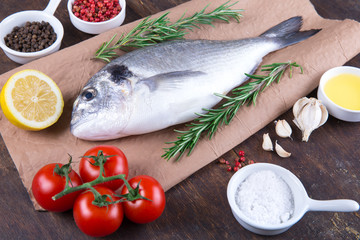 Raw fish dorado cooking and ingredients.