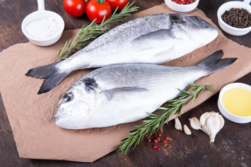 Raw fish dorado cooking and ingredients.