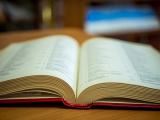 Fototapeta premium opened book on the table close up in the school