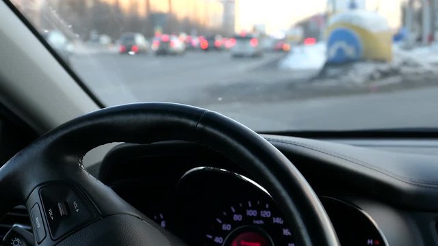 Woman Turning Steering Whell In Winter Day