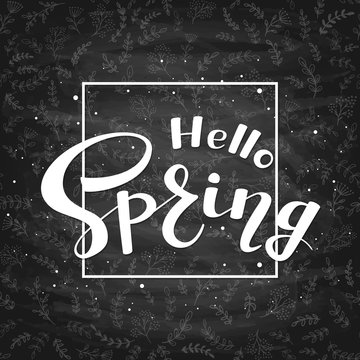 Text Hello Spring on black chalkboard background