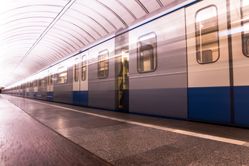 Subway metro train arriving at a station