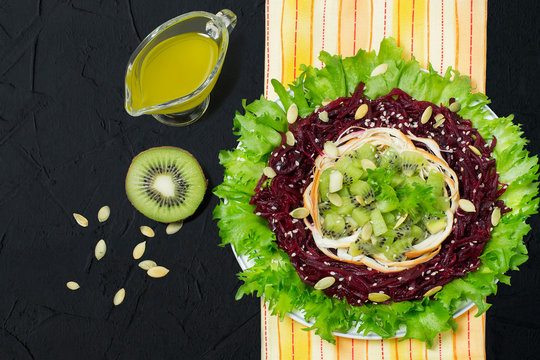 Delicious salad with beets, kiwi and smoked cheese