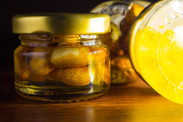 small jars with honey and nuts