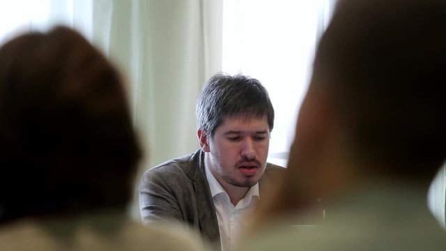 Man speaking at conference teacher