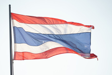 Fototapeta na wymiar Thai national three colors modern flag on pole with the wind