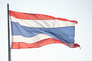 Thai national three colors modern flag on pole with the wind