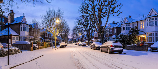 Winter sunrise in snowy suburb in London