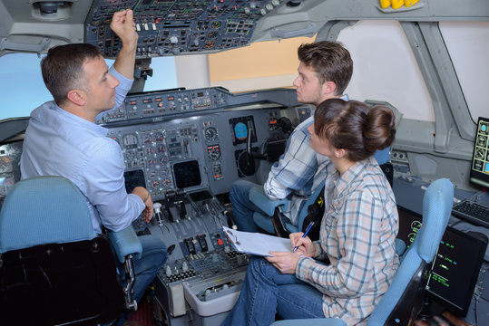 captain in the cockpit with interns