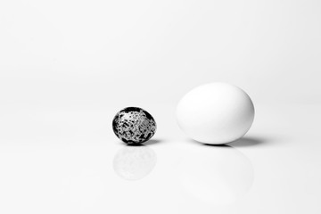 Two eggs of different sizes. Business concept.