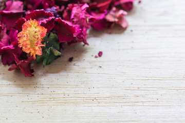 beautiful and aroma of dried flower petals many  on wood background.