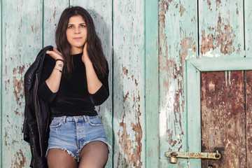 Fototapeta premium Young woman with short blue jeans