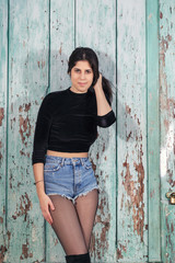 Fototapeta premium Young woman with short blue jeans