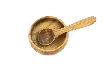 Wooden spoon and bowl isolated on white background.