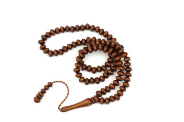 Old wooden rosary beads isolated on white background.