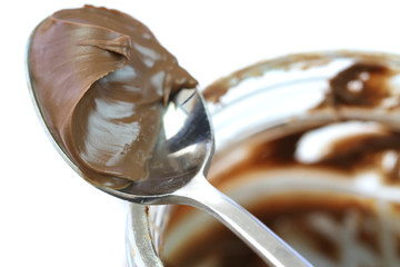 Nougat cream. Hazelnut chocolate eaten with spoon from the jar.