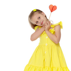 Little girl with a candy on a stick