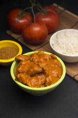 A Bowl of Chicken Tikka Masala on a Slate Chalkboard
