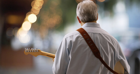 Two mid aged caucasian people sitting on a wood bench in San Francisco