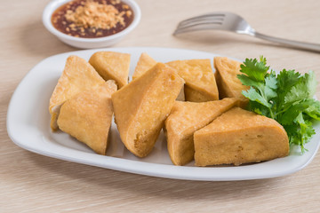 Fried tofu on plate and dip sauce