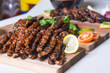 pork barbecue with peanut sauce, vinegar sauce and yoghurt sauce