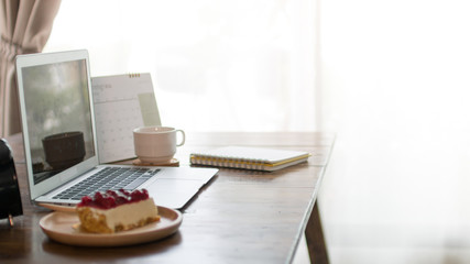 Home office desk with laptop computer
