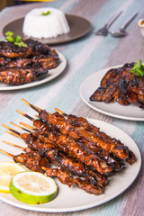 pork barbecue with peanut sauce, vinegar sauce and yoghurt sauce
