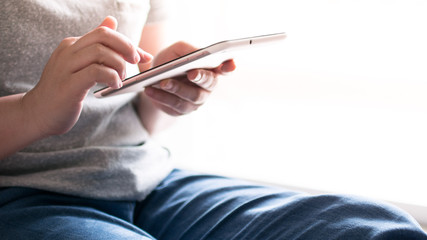 Woman hands touching and using digital tablet , lifestyle concept