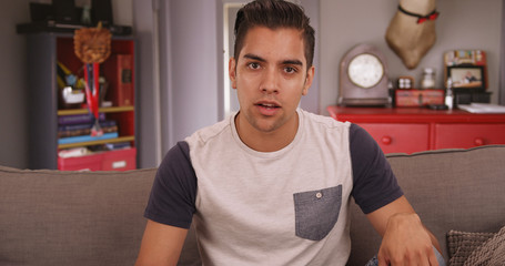 Young millennial Hispanic man talking to camera. Video chat with handsome Latino guy on computer...