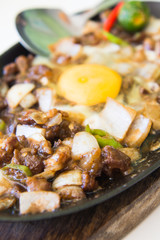 sizzling pork sisig with raw egg