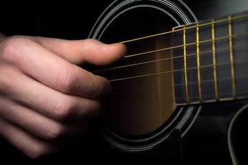 Close up of an guitar being