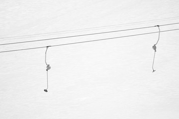 ski drag lift isolated in snowcapped mountains, texture background, ski concept in black and white