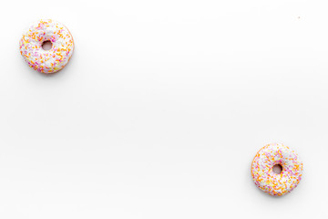 Unhealthy tasty sweets. Glazed donut on white background top view copy space