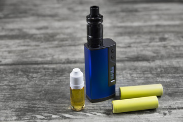 E - cigarette for vaping , technical devices.The liquid in the bottle 