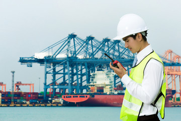  Asian engineers for the men of the shipping port. Using radio with work all the time.