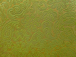 close up of retro olive green and gold vinyl abstract pattern