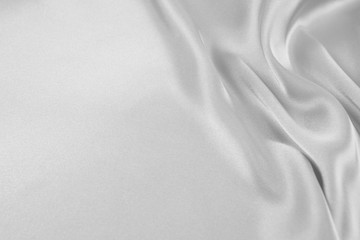 Fototapeta premium The texture of the satin fabric of white color for the background 
