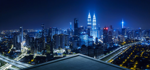 Open space balcony with Kuala Lumpur cityscape skyline view  . Night scene .