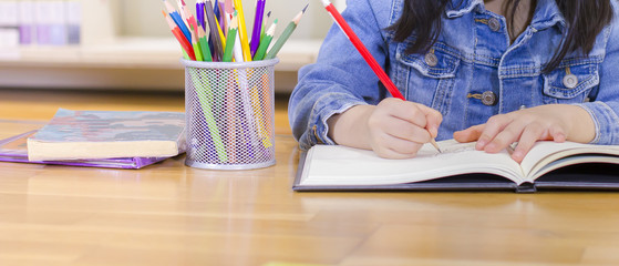 little girl writing paper, smiling cute child, Little girl painting in library, children education...