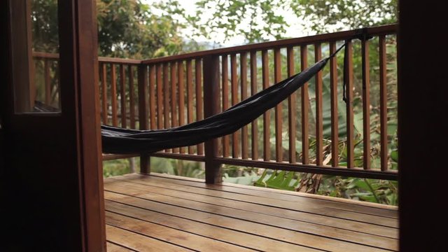 hammock on the terrace of a villa in the jungle