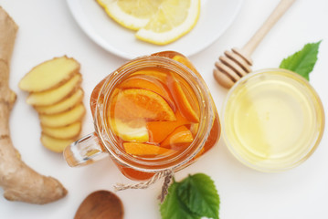 Fototapeta na wymiar Glass of Fruit tea Dring. Ginger, lemon and Honey. Health food Concept. Healthy Drink.
