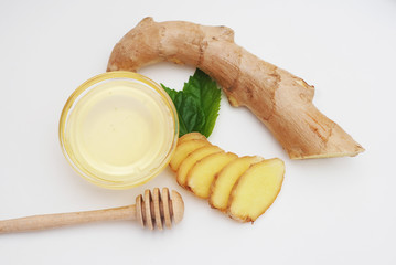 Honey with lemon and ginger isolated on a white background. Healthy food Ingredients.