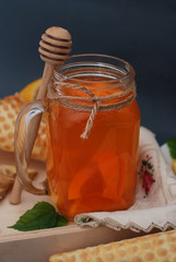Ginger or Fruit Citrus Tea. tea. Ginger, lemon, mint leaves and Honney. Waffle cones. Selective focus. Dark Background.
