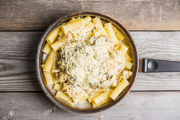 Fresh pasta with meat, mushrooms and cheese. Selective focus.