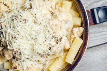 Fresh pasta with meat, mushrooms and cheese. Selective focus.