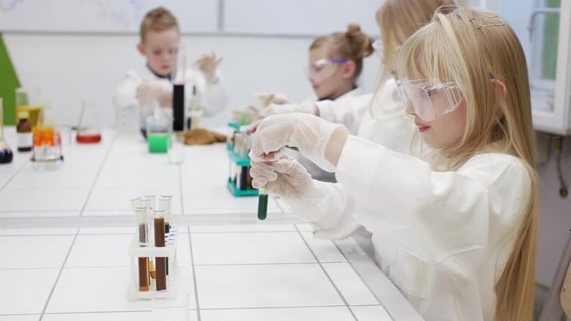 Children are experimenting in a chemistry lesson