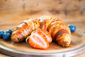 Fresh croissant and berries 