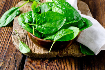 Fresh spinach on a cutting wooden board