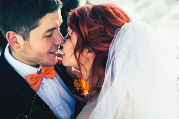 Wedding snowboarders couple just married at mountain winter