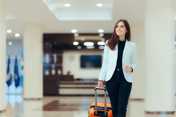 Elegant Business Woman with Travel Trolley Luggage in Hotel Lobby  - obrazy, fototapety, plakaty